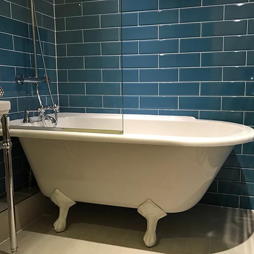 bath with blue tiles
